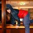 Jill posing and lolling in a bar wearing oldschool shiny nylon rainwear (Pics)