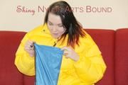 Jill ties, gagges and hoodes herself wearing a shiny yellow down jacket and a yellow rain pants(Pics)
