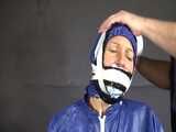 Watch Sandra beeing bound, pantygagged and finally pantyhooded in her shiny nylon Rainwear