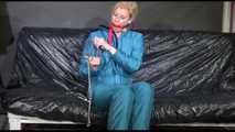Pia ties and gagges herself with cuffs wearing a sexy green shiny nylon down suit (Video)
