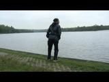 Enni wearing shiny nylon shorts and a rain jacket as well as a rain pants over the shorts (Video)