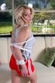 Nina tied and gagged in shiny red nylon shorts