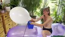 topless inflating balloons with the pump and popping them with the lighter
