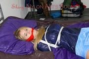 Samantha tied and gagged wearing a beautiful lightblue nylon shorts and a darkblue rain jacket (Pics)
