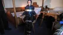 Rachel Adams bound, pantygagged and pantyhooded in shiny nylon Rainwear