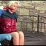 Pia tied and gagged on a princess bed in an old cellar wearing a sexy dark blue nylon shorts and an oldschool red rain jacket (Video)