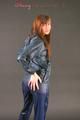 Alina posing in a studio wearing a supersexy darkblue rainwear combination (Pics)