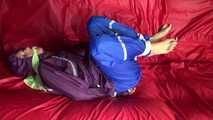 SANDRA being tied and gagged on a sofa with ropes and a clothgag wearing a sexy blue shiny nylon rain pants and a purple rain jacket  (Video)