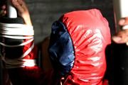 Katharina tied and gagged in shiny nylon rainwear