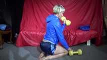 Watching sexy Sonja wearing a supersexy oldschool blue shiny nylon shorts and a lightblue rain jacket during her workout with barbells (Video)