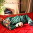 Lucy tied and gagged on bed wearing a sexy green rainwear combination (Pics)