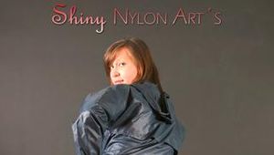 Alina posing in a studio wearing a supersexy darkblue rainwear combination (Pics)