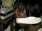 BLACK BANK TELLER IS MOUTH STUFFED, CLEAVE GAGGED & ROPE TIED TO CHAIR  (D46-2)