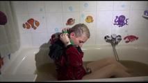 Mara sitting in her bathtub wearing a sexy shiny nylon shorts and a rain jacket while bounding herself (Video)