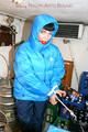 Jill tied and gagged in a refrigeration room wearing a blue shiny nylon down jacket and a black rain pants (Pics)
