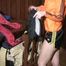 Jill Diamond wearing a sexy shiny nylon shorts and a rain jacket traing on other shorts and jackets (Video)