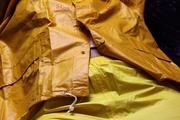Pia tied and gagged in a shiny nylon rainsuit 