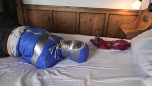 Watch Rachel Adams bound and gagged in shiny nylon Rainwear