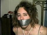 CROTCH ROPED, BALL & TAPE GAGGED BRASS BED TIED DAMSEL (D19-9)