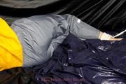 Samanthy bound and gagged in shiny nylon rainwear