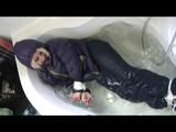 03:00 Min. video with Nina tied and gagged in a shiny nylon downjacket