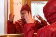 Jill ties, gagges and hoodes herself in front of a mirror and in an strairway wearing a sexy shiny nylon rain pants in black and a red rain jacket (Pics)