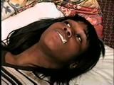 BLACK FEISTY & CUTE SARAH IS TAPE GAGGED, MOUTH STUFFED, TIED WITH RAWHIDE & TIGHTLY HANDGAGGED (D53-16)