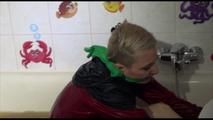 Mara sitting in her bathtub wearing a sexy shiny nylon shorts and a rain jacket while bounding herself (Video)