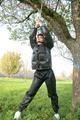 Jill tied and gagged outdoor on a tree wearing a sexy black downjacket and a black rain pants (Pics)