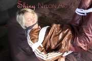 Watching sexy Sonja being tied and gagged on a bed with ropes and a clothgag wearing a supersexy shiny brown nylon pants and a brown rain jacket (Pics)