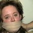 SEXY JULIE IS CLEAVE, HAND, OTM, WRISTS-GAGGED, MOUTH STUFFED & SUCKS HER OWN TOES (D31-12)