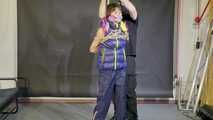 Lana bound and gagged in a shiny nylon Downvest
