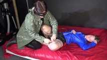 Watching sexy SONJA being tied and gagged with ropes and a clothgag by another girl on the bed both wearing sexy shiny nylon clothes (Video)