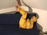 Two videos of our archive girls tied and gagged in shiny nylon rainwear