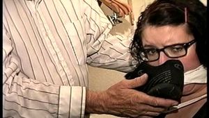 25 YEAR OLD DAY CARE WORKER IS MOUTH STUFFED, HANDGAGGED, TOE-TIED, F0RCED STINKY SHOE SMELLING WHILE TIGHTLY CHAIR TIED (D69-16)