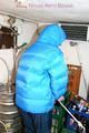 Jill tied and gagged in a refrigeration room wearing a blue shiny nylon down jacket and a black rain pants (Pics)