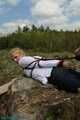 In the forest Hogtied and handcuffed