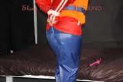 Watching Jill wearing a sexy shiny nylon rain pants and three shiny nylon rain jackets and a life jacket being tied and gagged and HOODED three times (Pics)