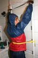 Stella tied, gagged and hooded on an radiator wearing a shiny red/blue rain combination (Pics)