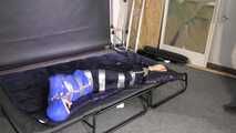 Lana tied and gagged in shiny nylon Rainwear desperately trying to free herself