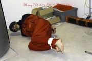 Shelly tied and gagged in shiny nylon rainwear