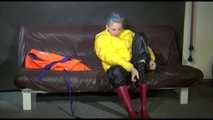 Watching Mara putting on a down jacket, rubber boots and a lifevest (Video)