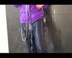 Get an Archive Video with Mara enjoying a shower with her shiny nylon downjacket