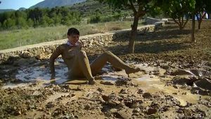Naked in the mud