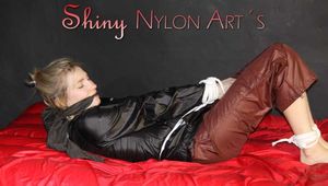 NEW MODELL MIA being tied and gagged with ropes and a clothgag wearing a sexy brown shiny nylon pants and a black rain jacket (Pics)