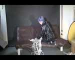 Watching Mara wearing sexy black rainwear during sorting her ropes for the next bondage session (Video)