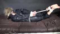 Watching Pia being tied and gagged with ropes and a clothgag wearing sex black shiny nylon suit (Video)