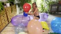 topless inflating balloons with the pump and popping them with the lighter