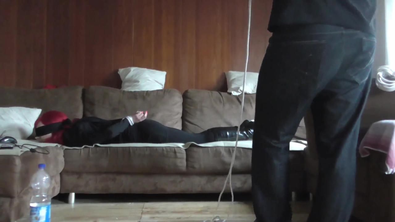 Angi hogtied on couch 1/2