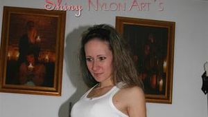 Petra lolling on the sofa and posing in shiny nylon shorts (Pics)